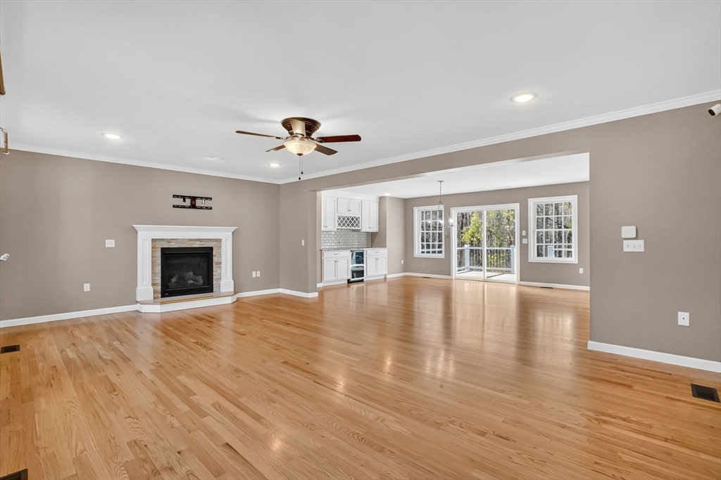 733 Monson Road Wilbraham, MA 01095 - Photo 4 of 40 a view of an empty room with wooden floor and a window