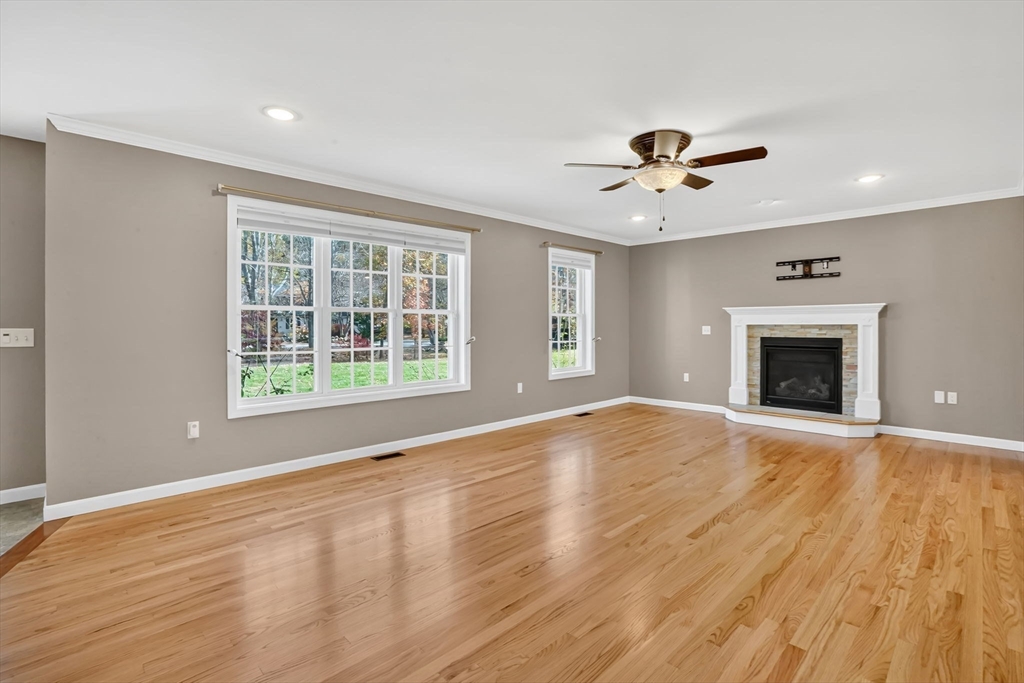 733 Monson Road Wilbraham, MA 01095 - Photo 6 of 40 a view of an empty room with a window and fireplace