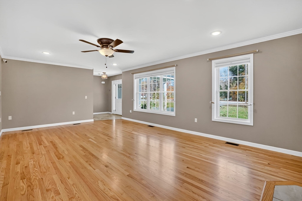 733 Monson Road Wilbraham, MA 01095 - Photo 7 of 40 a view of an empty room with wooden floor and a window