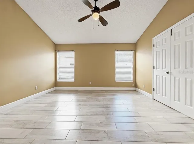 a view of a room with wooden floor and window