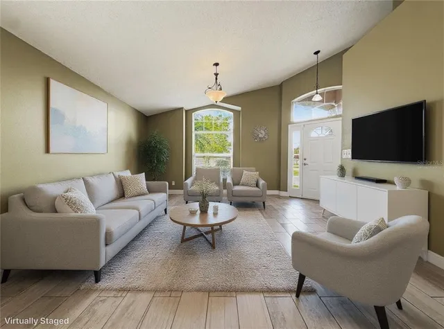 a large kitchen with stainless steel appliances granite countertop a stove a sink and a granite counter tops