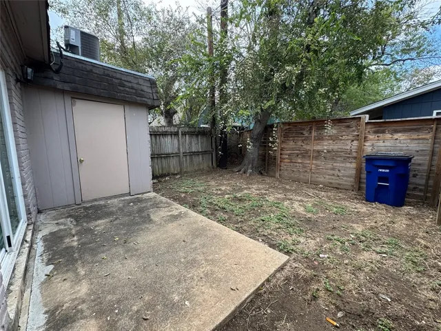 a view of a backyard of the house