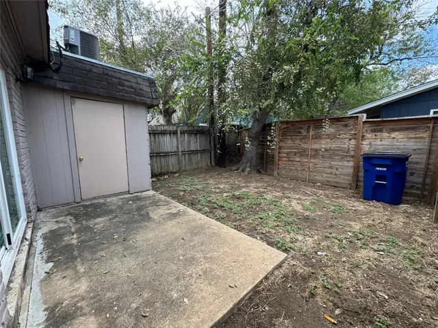 a view of a backyard of the house