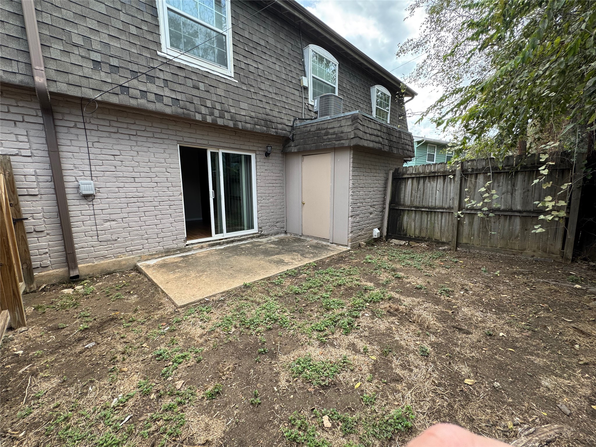 4902 West Wind Trail, Unit 103 Austin, TX 78745 - Photo 18 of 20 a front view of a house with a yard