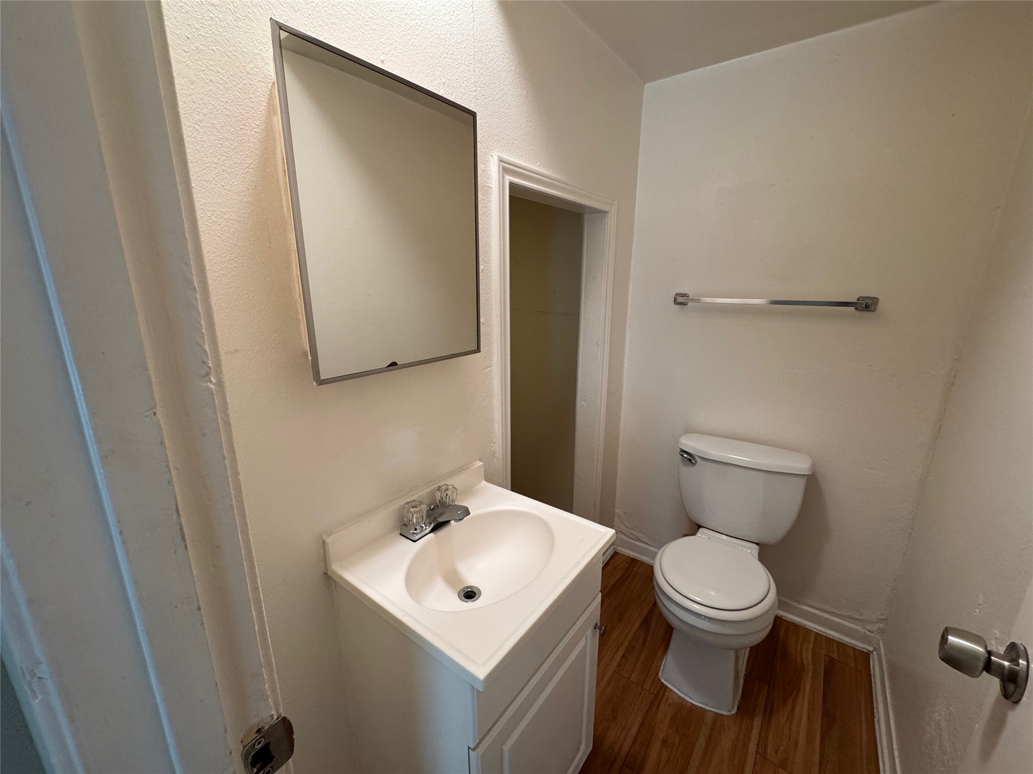 4902 West Wind Trail, Unit 103 Austin, TX 78745 - Photo 6 of 20 a white toilet sitting next to a bathroom sink