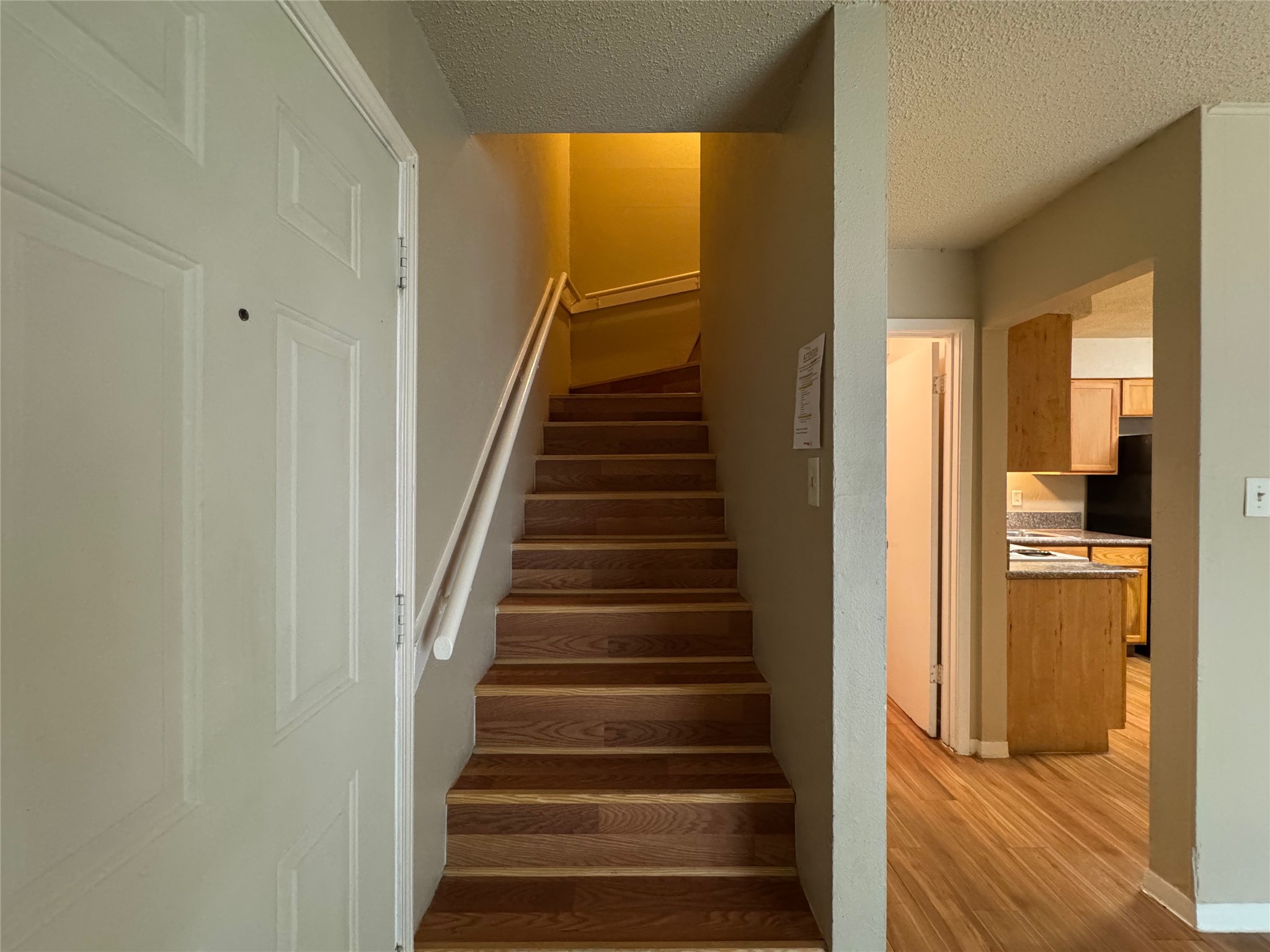 4902 West Wind Trail, Unit 103 Austin, TX 78745 - Photo 8 of 20 a view of a hallway with wooden floor and entryway