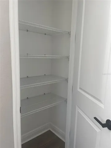 a room with a window and wooden floor