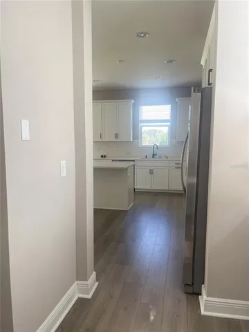 a living room with hard wood floor