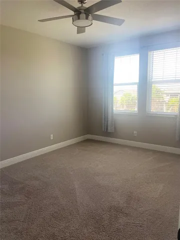 an empty room with fan