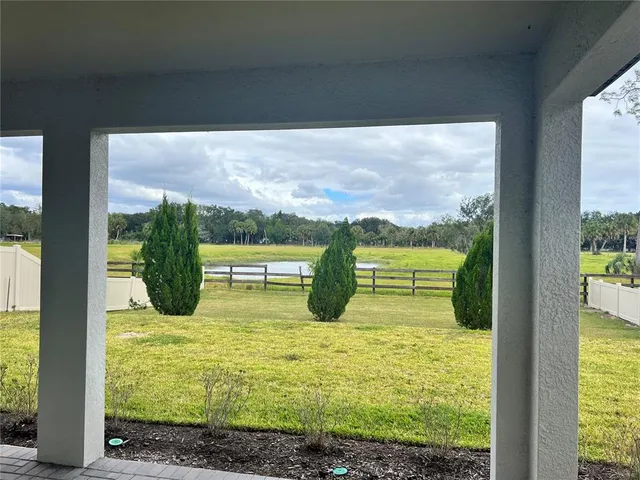 a view of swimming pool from a yard