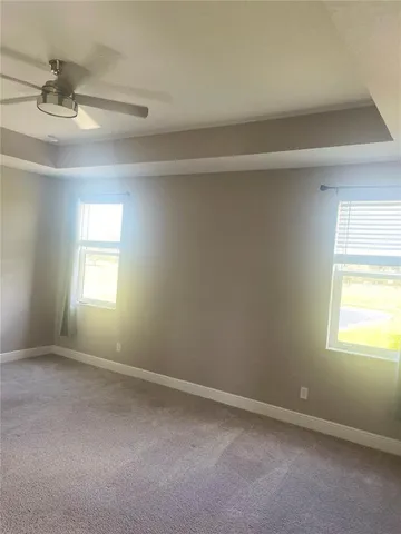 a large white kitchen with a sink