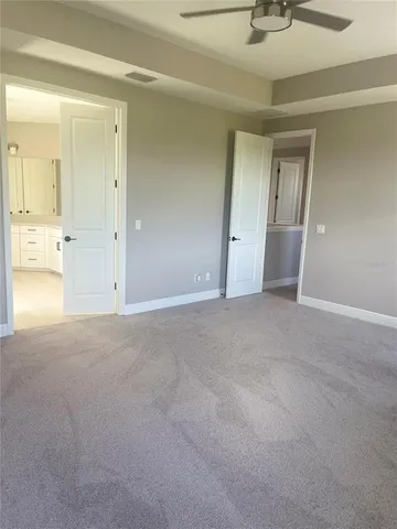 a white toilet sitting next to a sink