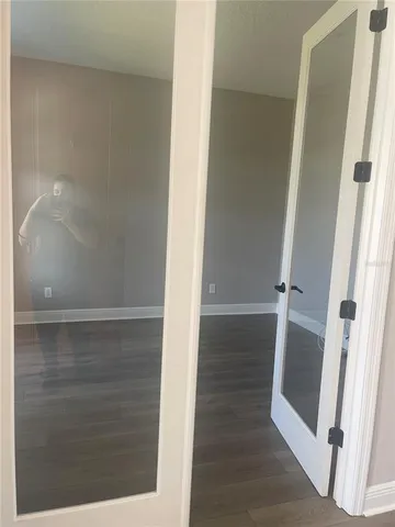 view of a room with wooden floor