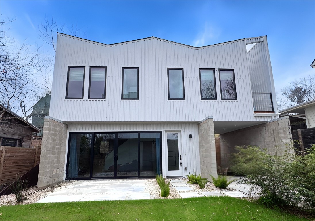 1206 Luna Street Austin, TX 78721 - Photo 7 of 27 a front view of a house with a yard