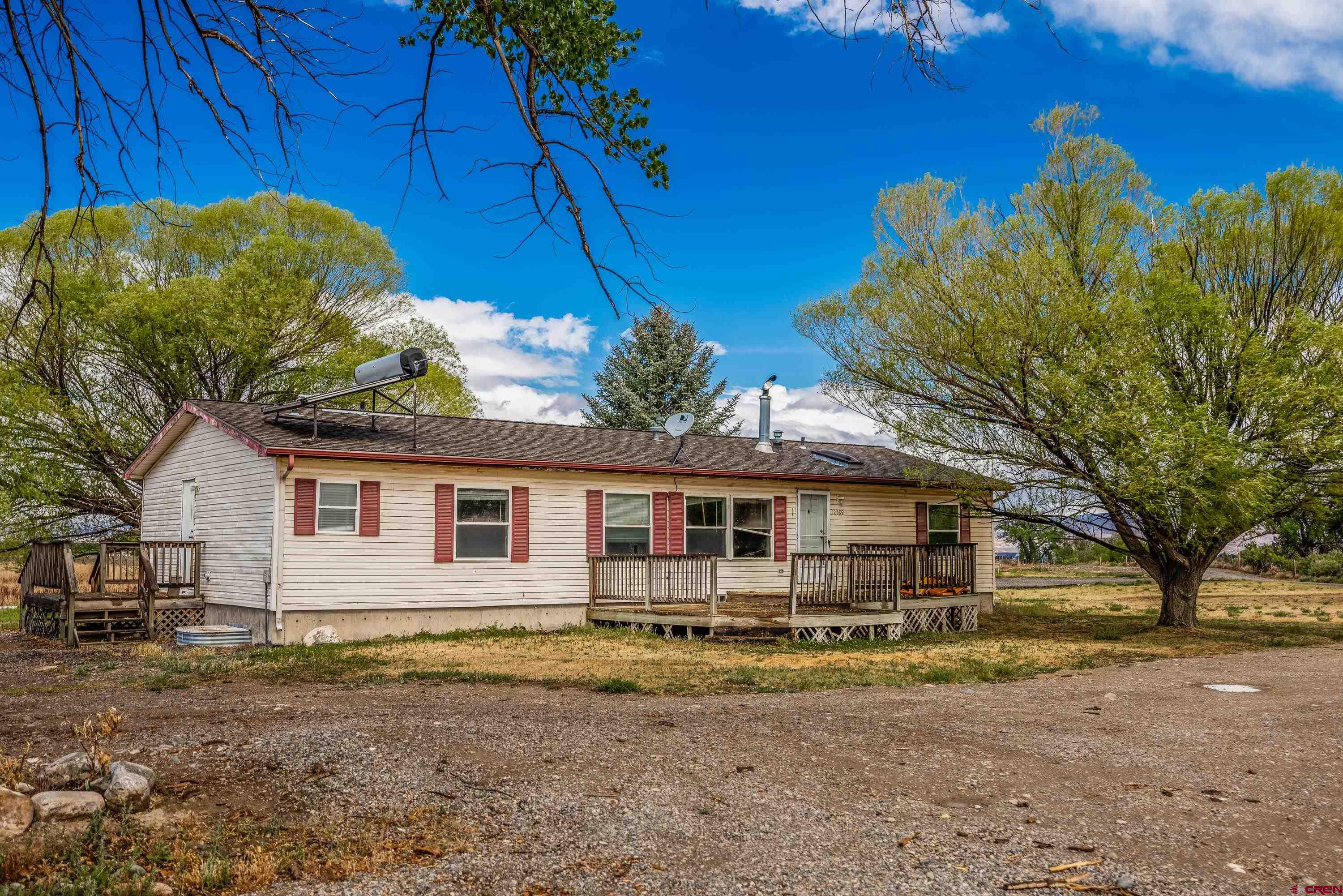 17377 Breeze Road Delta, CO 81416 - Photo 20 of 45 a view of a house with a backyard