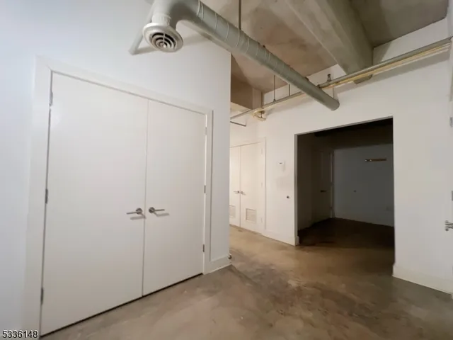a view of a utility room with closet
