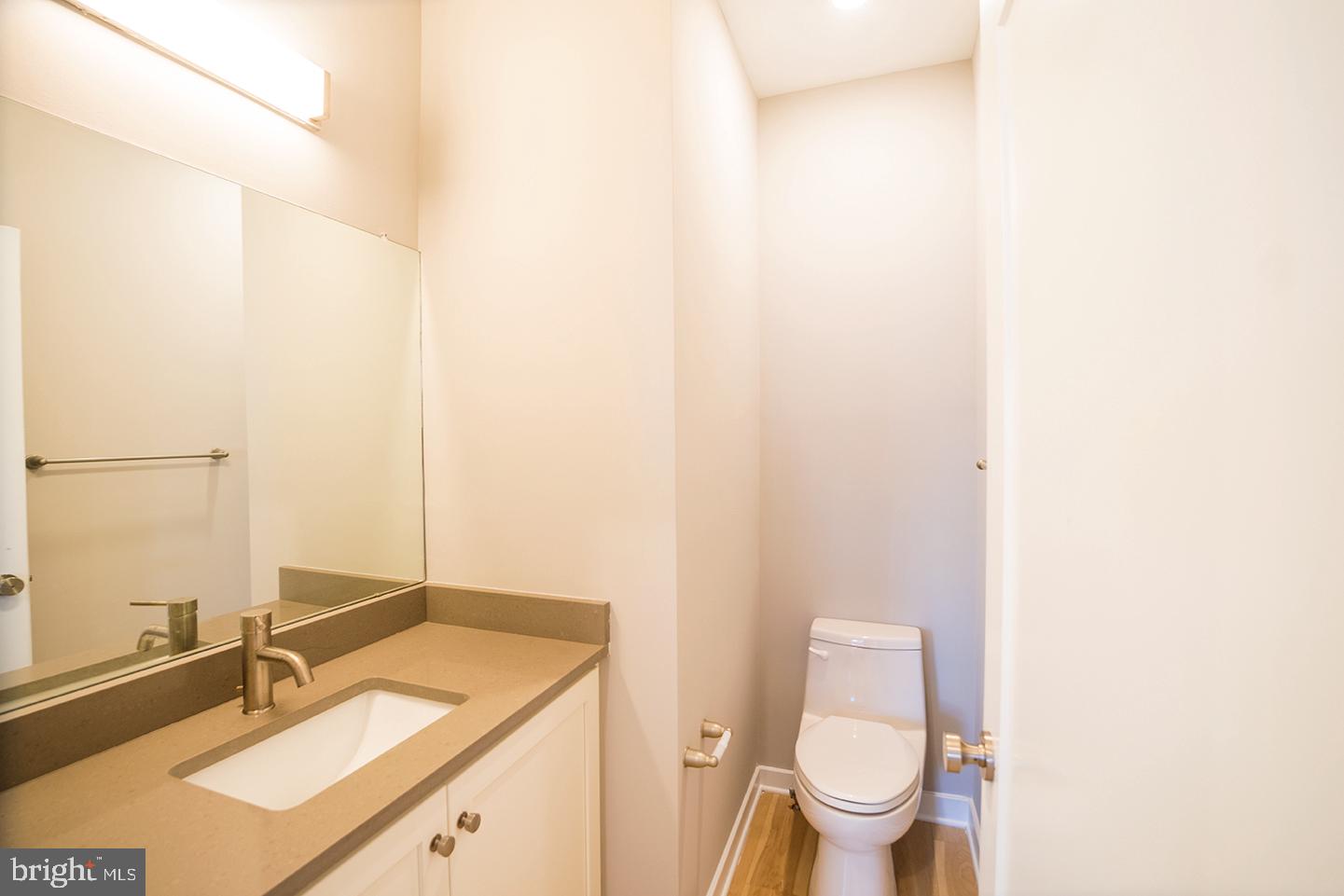 129 South 49th Street, Unit 1F Philadelphia, PA 19139 - Photo 8 of 18 a bathroom with a sink and a toilet