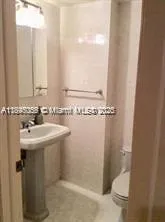 a bathroom with a sink and mirror