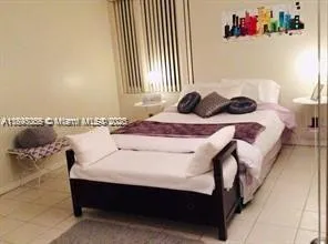 a bedroom with a bed and a table