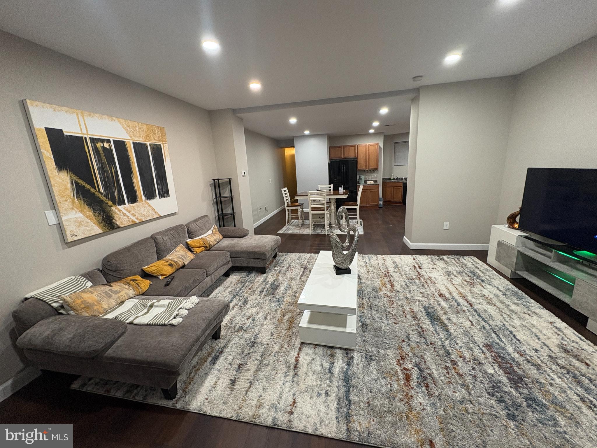 222 North Liberty Street, Unit 2 Baltimore, MD 21201 - Photo 1 of 15 a living room with furniture and a flat screen tv