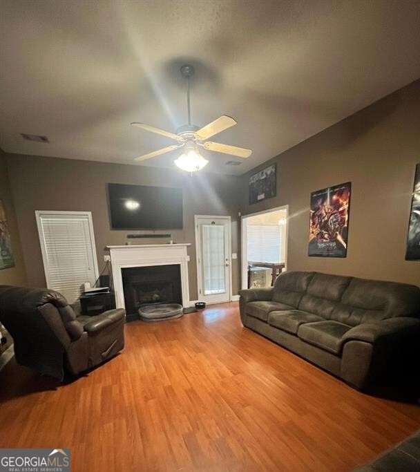 208 Sugarloaf Parkway Perry, GA 31069 - Photo 3 of 11 a living room with furniture and a fireplace
