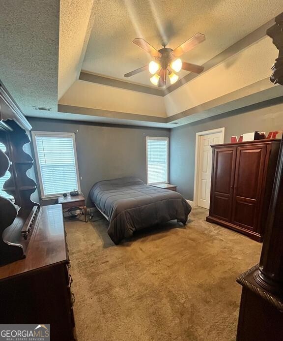 208 Sugarloaf Parkway Perry, GA 31069 - Photo 8 of 11 a bedroom with a bed and wooden floor