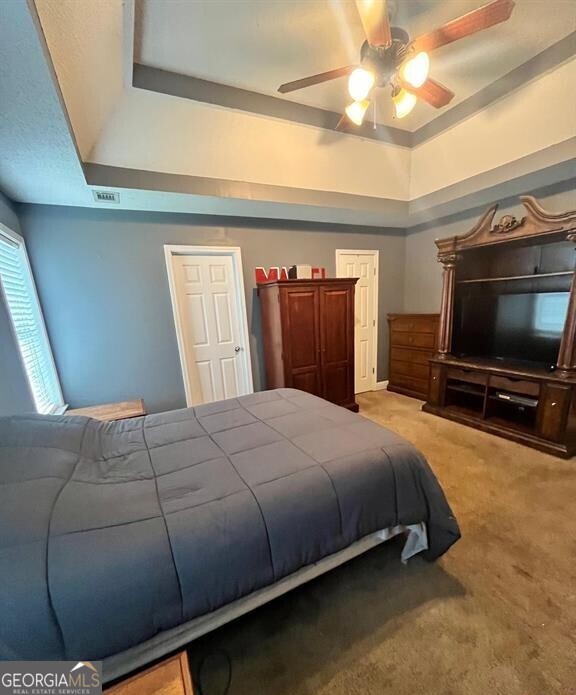 208 Sugarloaf Parkway Perry, GA 31069 - Photo 9 of 11 a bedroom with a bed and a flat screen tv