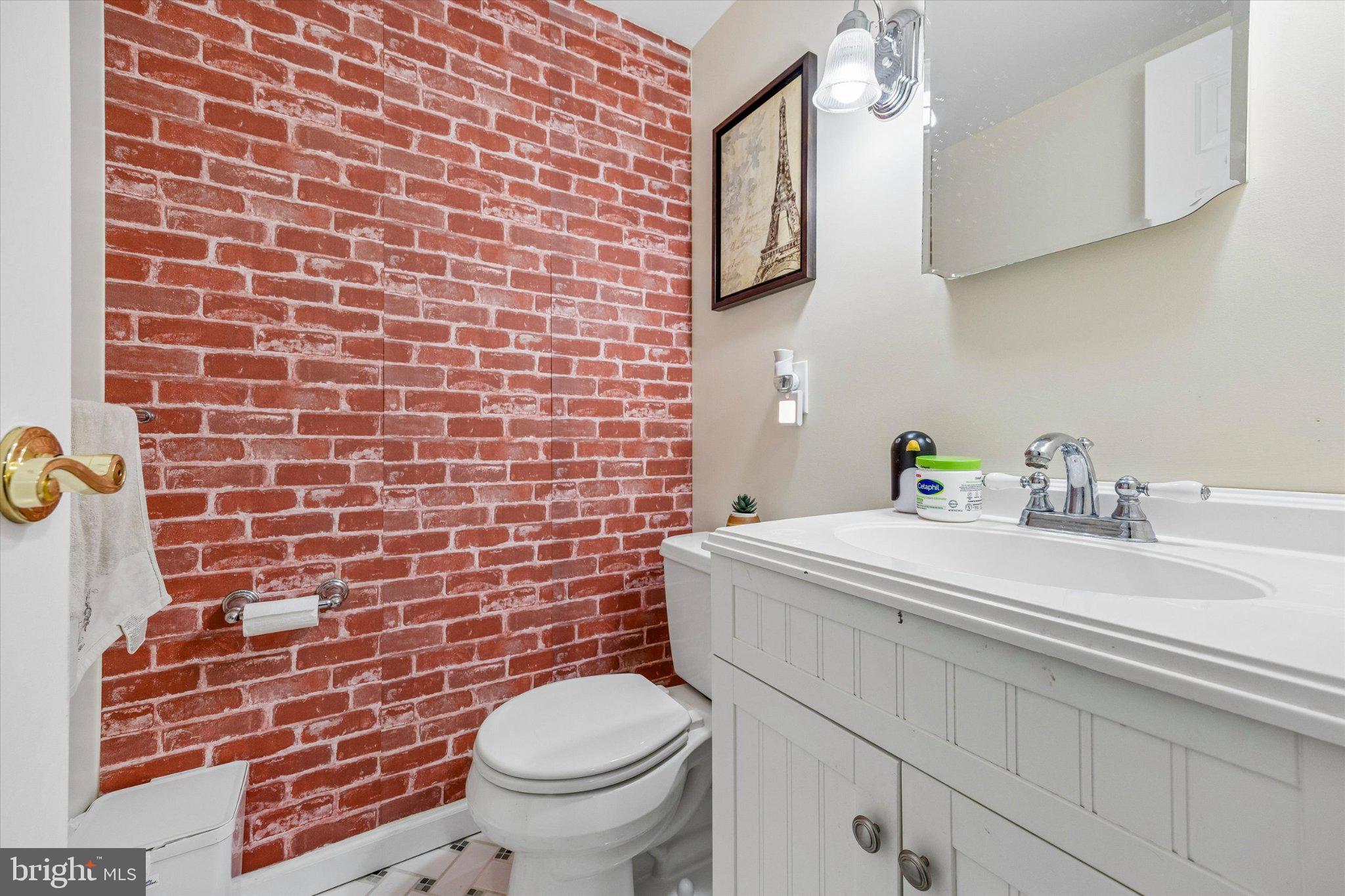 24 Independence Place Newtown, PA 18940 - Photo 8 of 15 a bathroom with a sink a toilet and a mirror