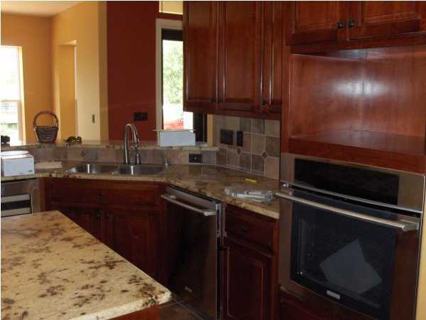 196 West Burnis Road Crestview, FL 32539 - Photo 13 of 13 a kitchen with a sink and a stove