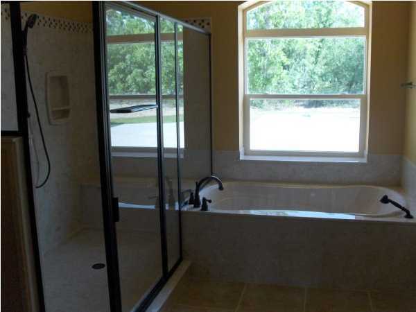 196 West Burnis Road Crestview, FL 32539 - Photo 10 of 13 a bathroom with a bathtub and a shower