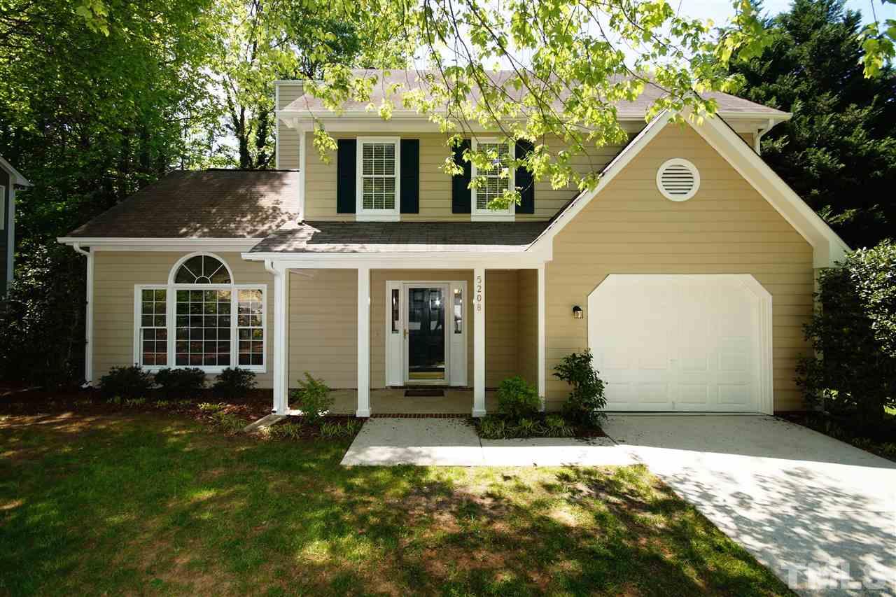 5208 Blakeley Lane Raleigh, NC 27613 - Photo 1 of 25 a front view of a house with a yard