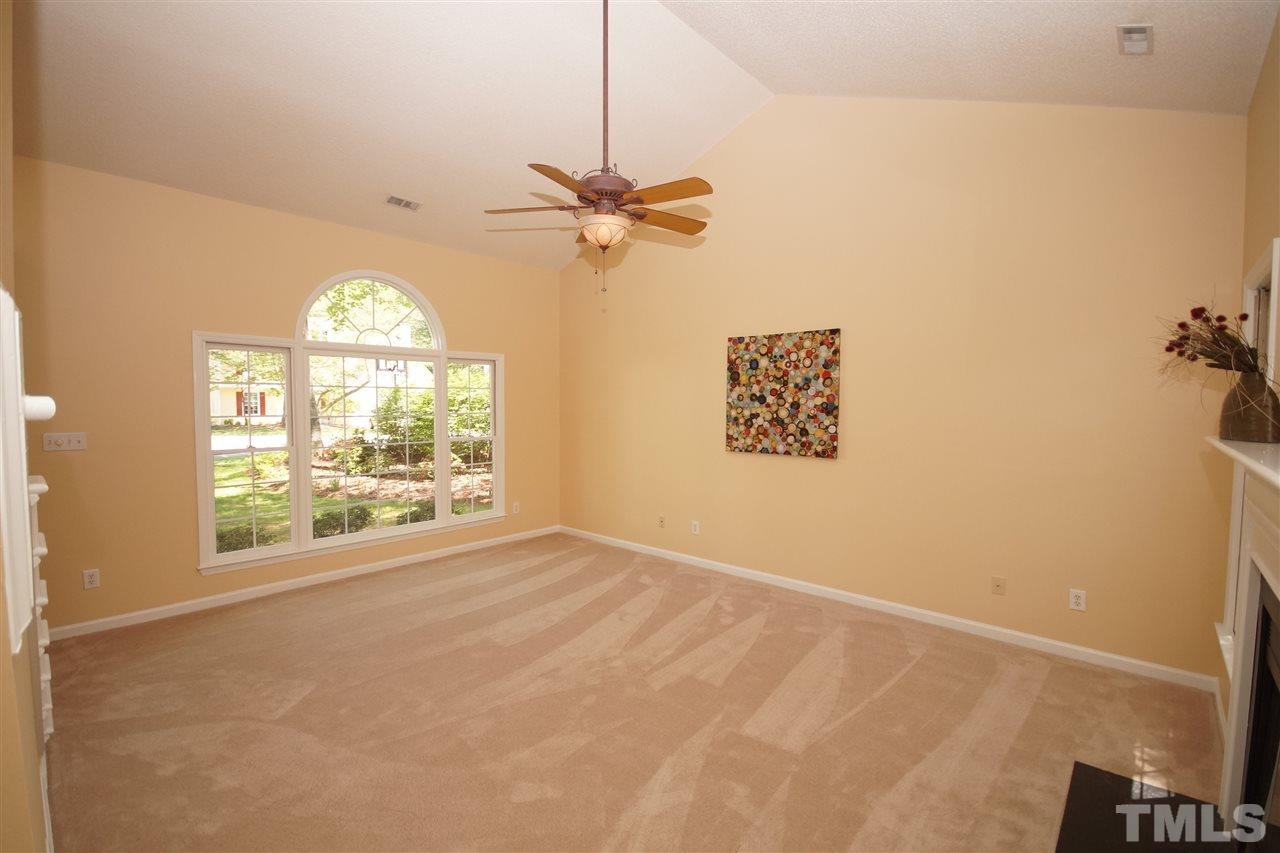 5208 Blakeley Lane Raleigh, NC 27613 - Photo 8 of 25 an empty room with windows and fan