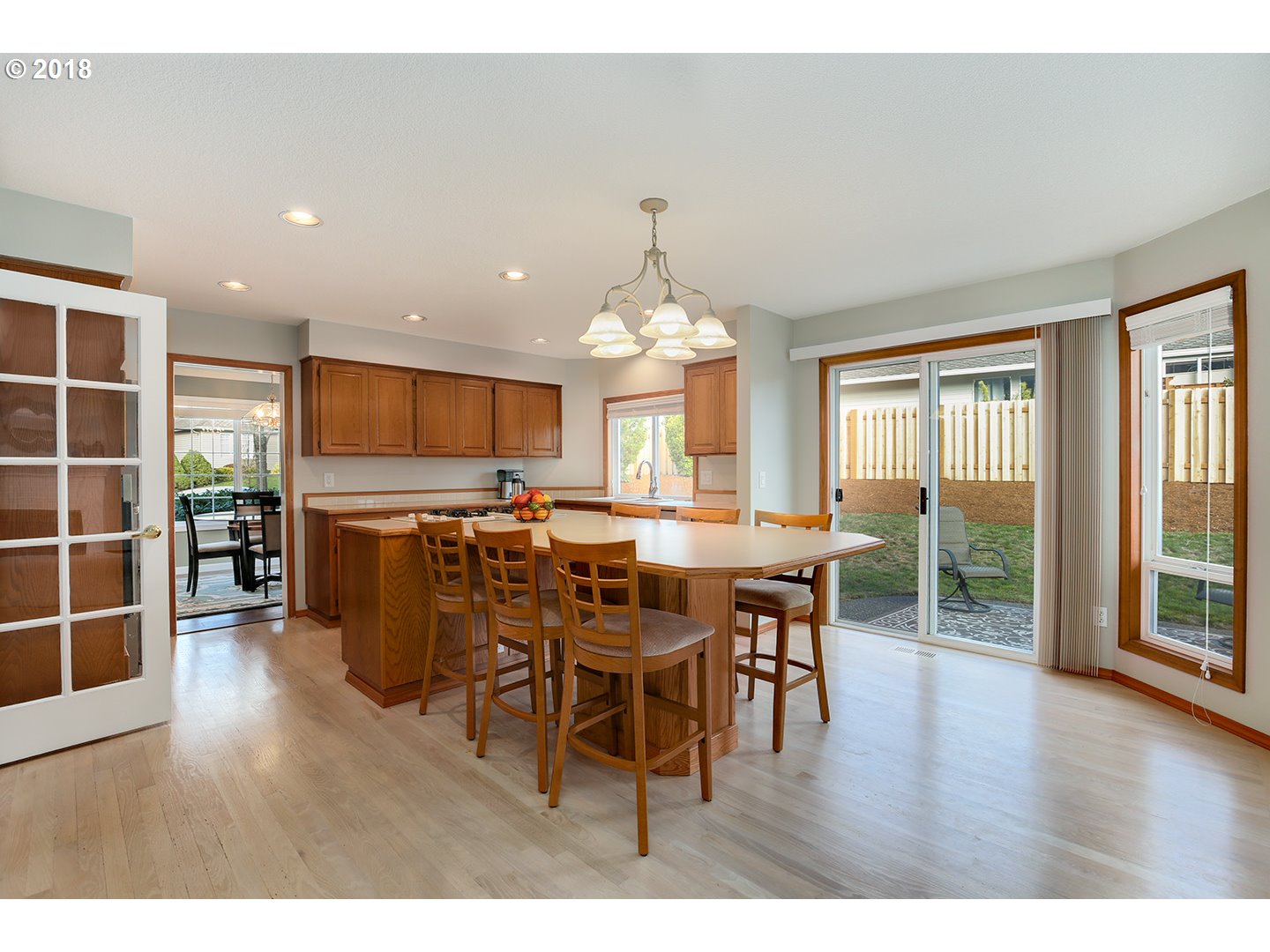 10470 Southwest 135th Avenue Beaverton, OR 97008 - Photo 12 of 32 a view of a dining room with furniture window and wooden floor