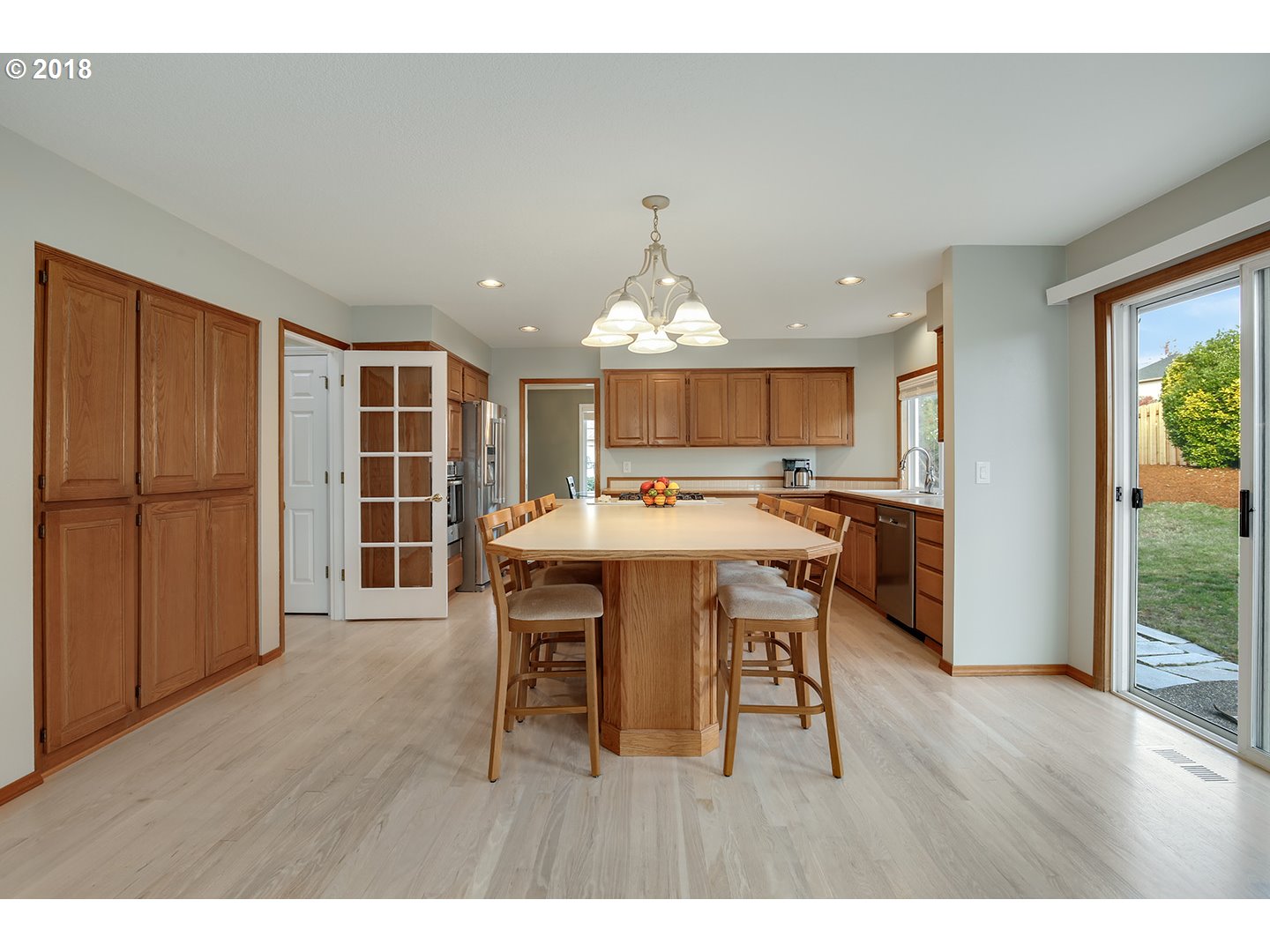 10470 Southwest 135th Avenue Beaverton, OR 97008 - Photo 13 of 32 a open kitchen with a table and chairs
