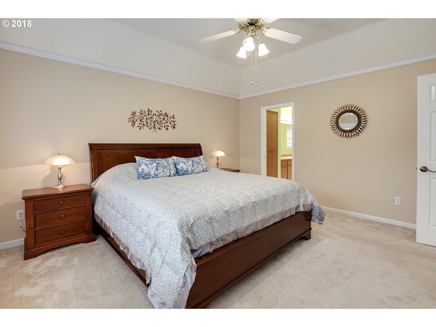 10470 Southwest 135th Avenue Beaverton, OR 97008 - Photo 23 of 32 a bedroom with a bed and a chandelier