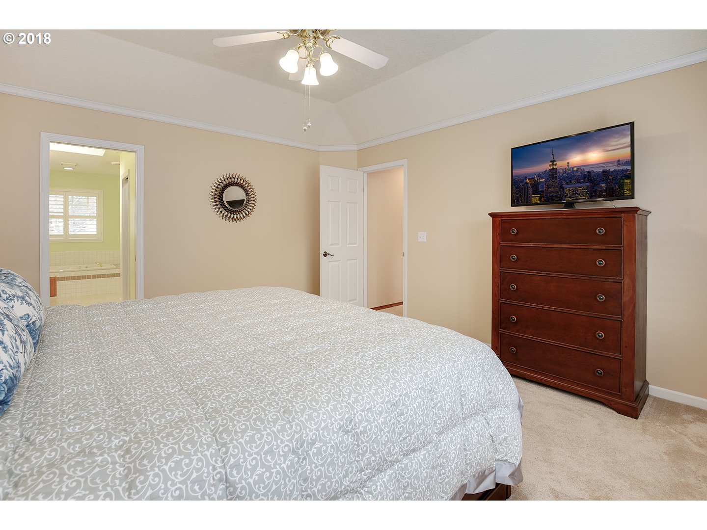 10470 Southwest 135th Avenue Beaverton, OR 97008 - Photo 24 of 32 a bedroom with a bed and a flat screen tv