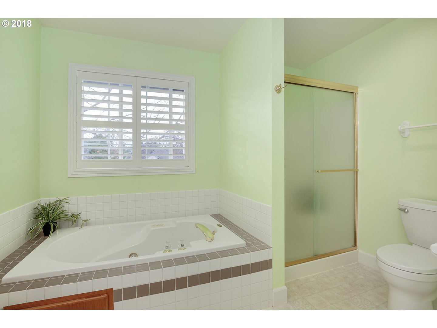 10470 Southwest 135th Avenue Beaverton, OR 97008 - Photo 27 of 32 a bathroom with a bathtub and a shower