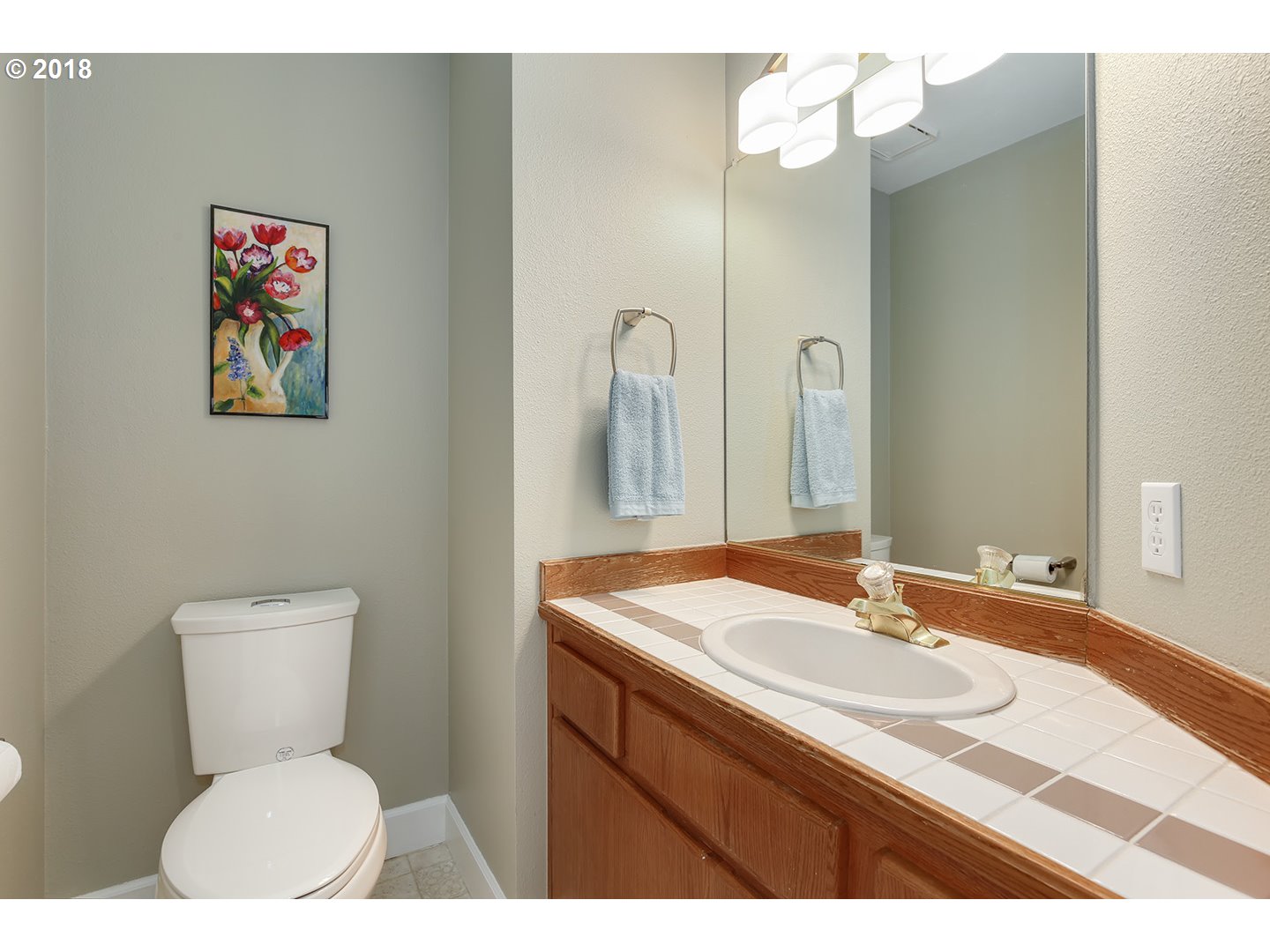 10470 Southwest 135th Avenue Beaverton, OR 97008 - Photo 28 of 32 a bathroom with a toilet a sink and mirror
