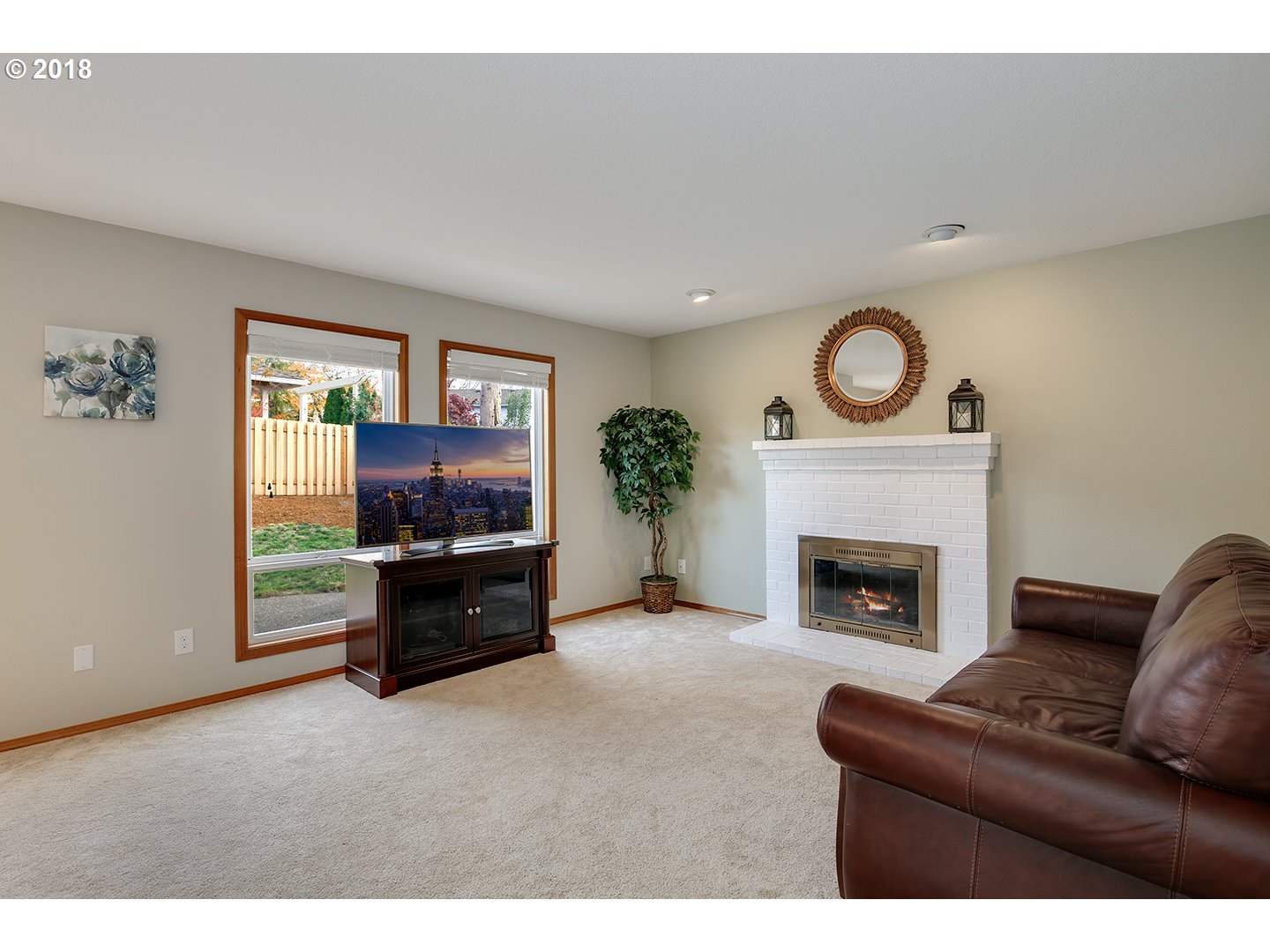 10470 Southwest 135th Avenue Beaverton, OR 97008 - Photo 9 of 32 a living room with furniture and a fireplace