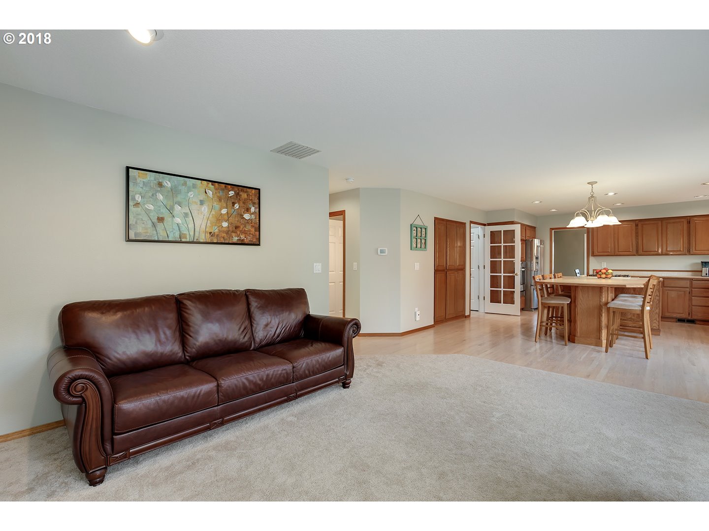 10470 Southwest 135th Avenue Beaverton, OR 97008 - Photo 10 of 32 a living room with furniture and kitchen view
