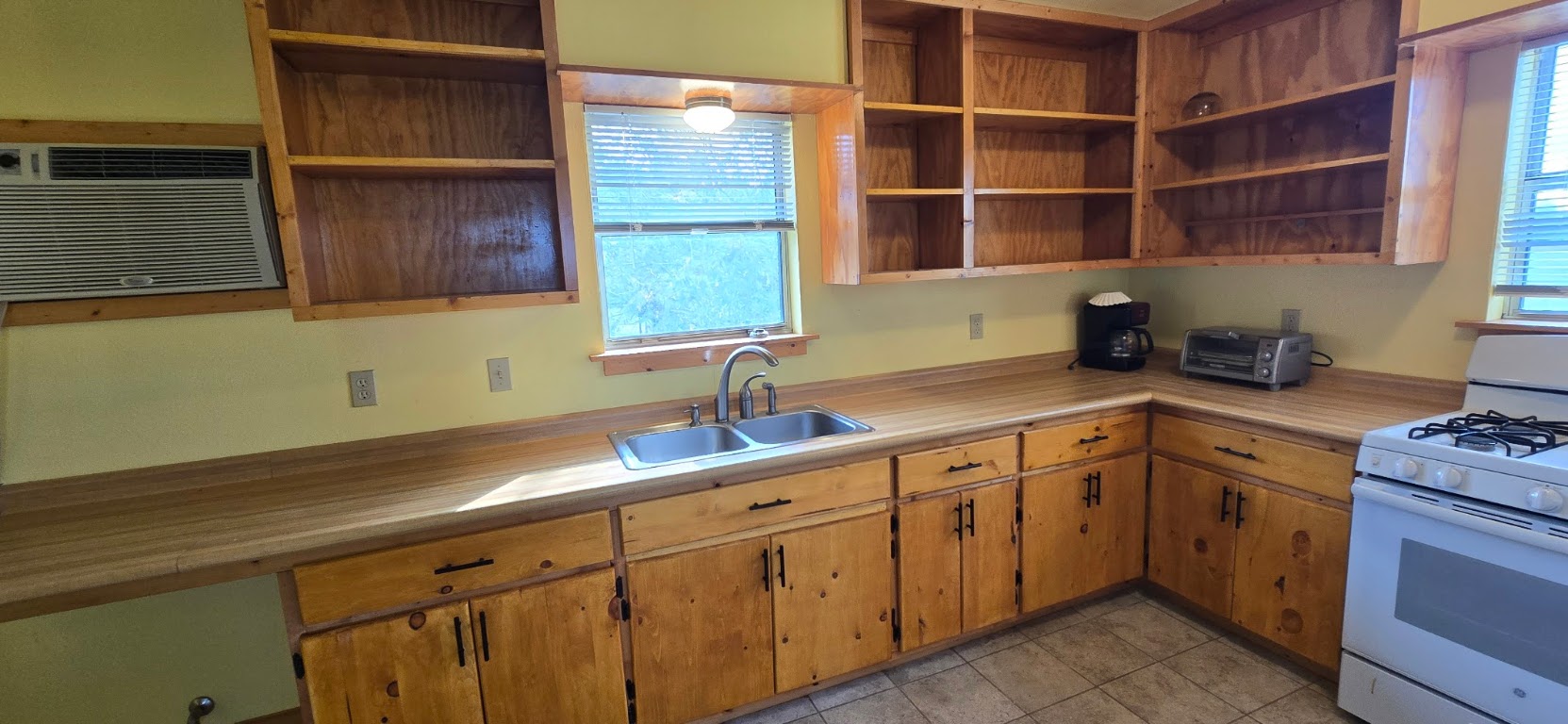 201 930 Par Taylor, TX 76574 - Photo 13 of 27 a kitchen with a sink and cabinets