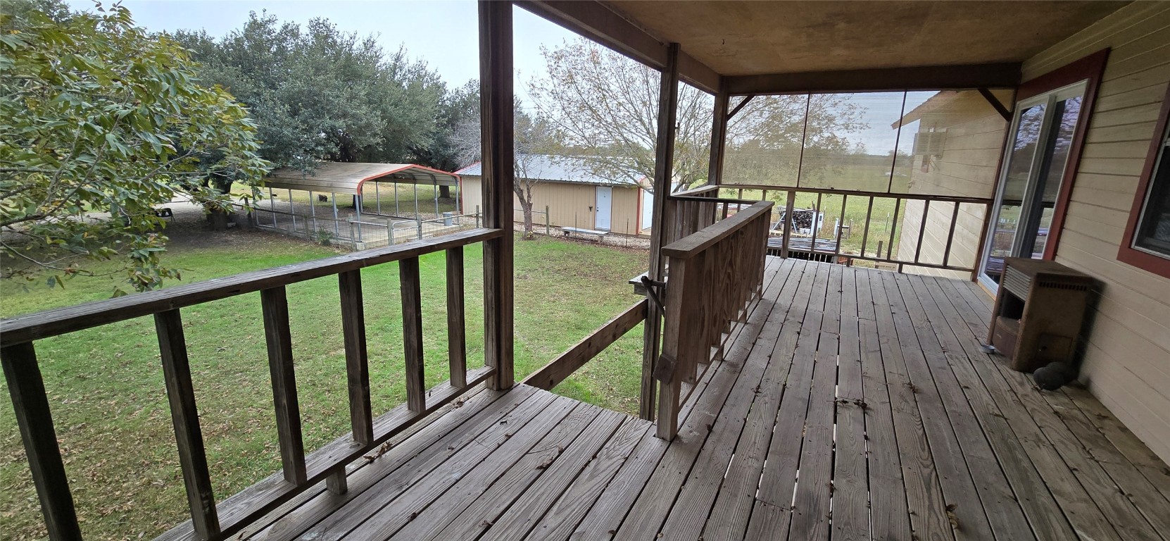 201 930 Par Taylor, TX 76574 - Photo 17 of 27 a view of balcony with wooden floor and iron fence