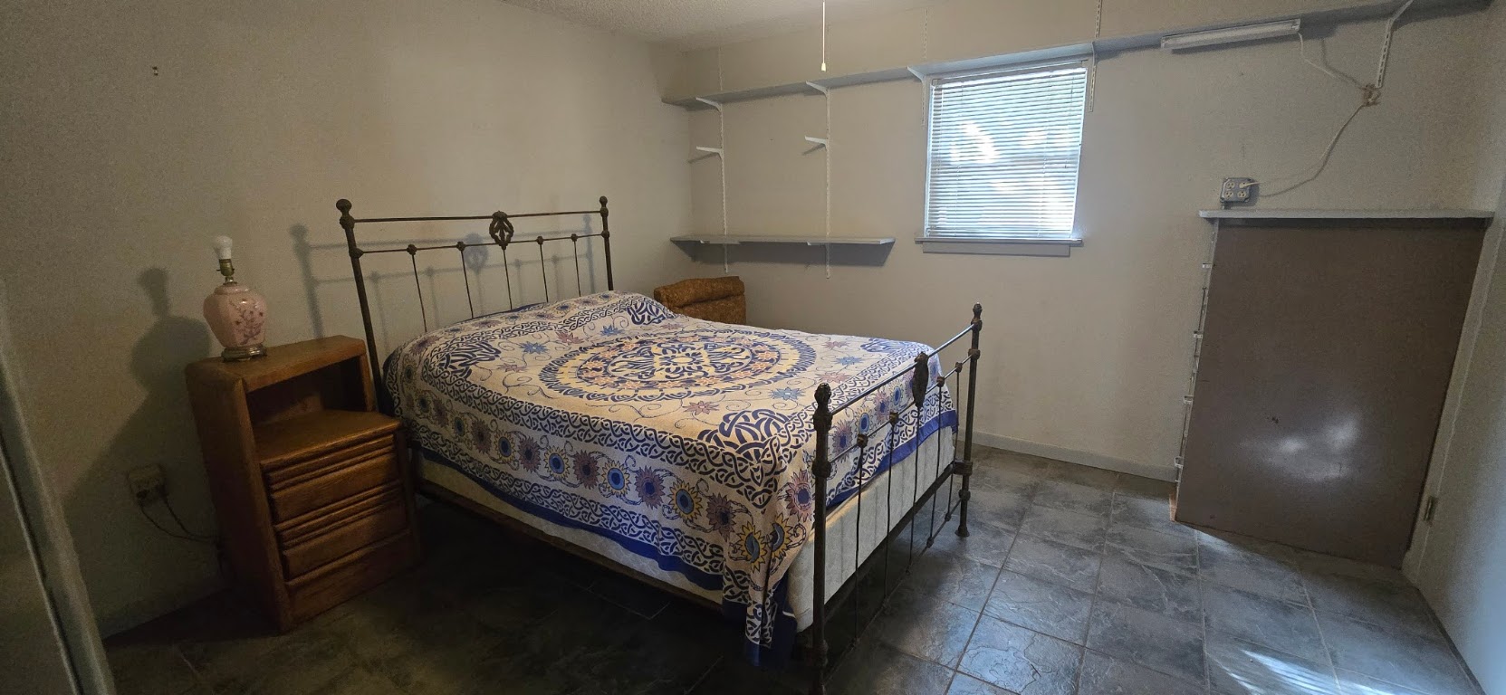 201 930 Par Taylor, TX 76574 - Photo 27 of 27 a bed sitting in a bedroom next to a window
