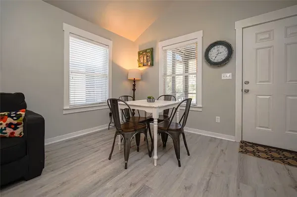 a dining room with furniture and window