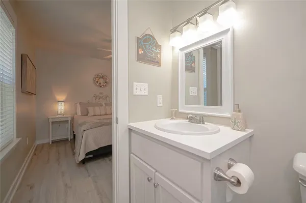 a bathroom with a sink a vanity and mirror