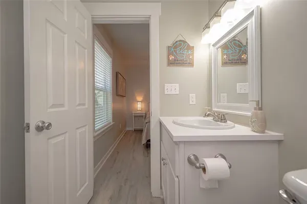 a en suite bathroom with a sink a toilet and a mirror