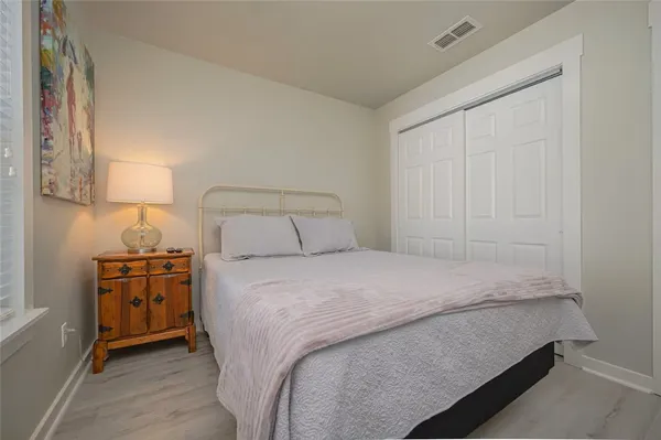 a bedroom with a bed and a cabinets