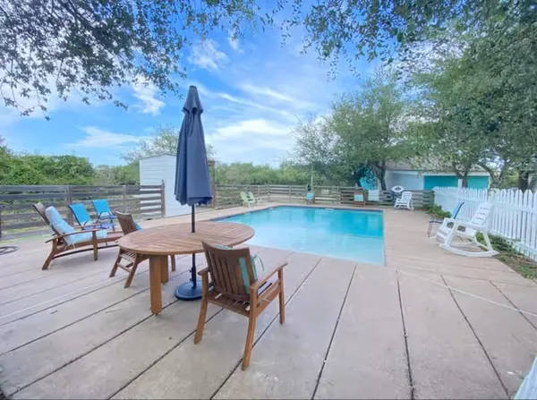 a view of a patio with a table chairs and a table
