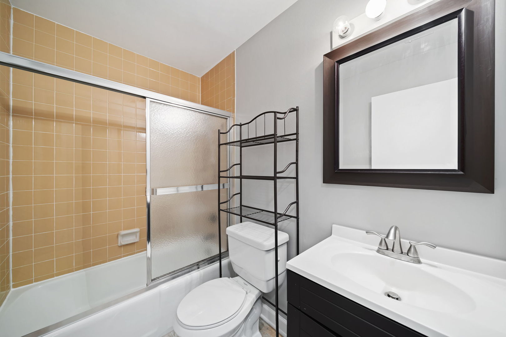 425 Walnut Creek Road, Unit 1401 Lisle, IL 60532 - Photo 12 of 19 a bathroom with a sink a toilet and shower