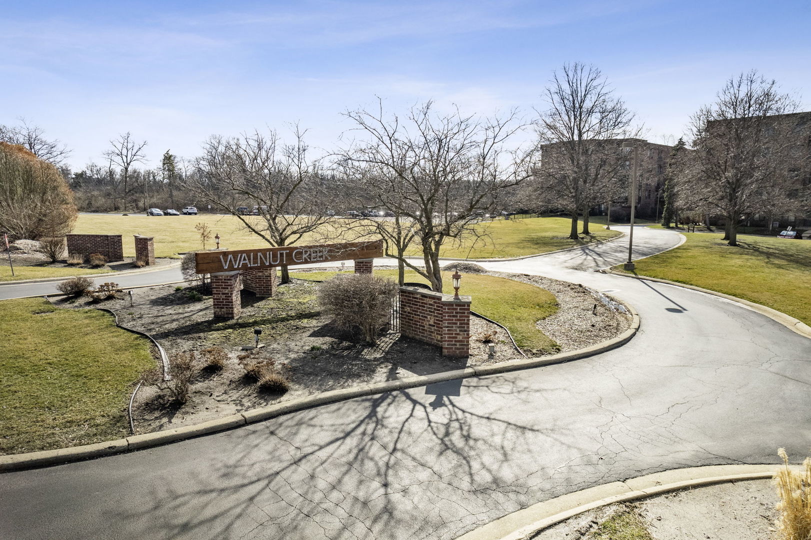425 Walnut Creek Road, Unit 1401 Lisle, IL 60532 - Photo 13 of 19 a view of a swimming pool with a yard